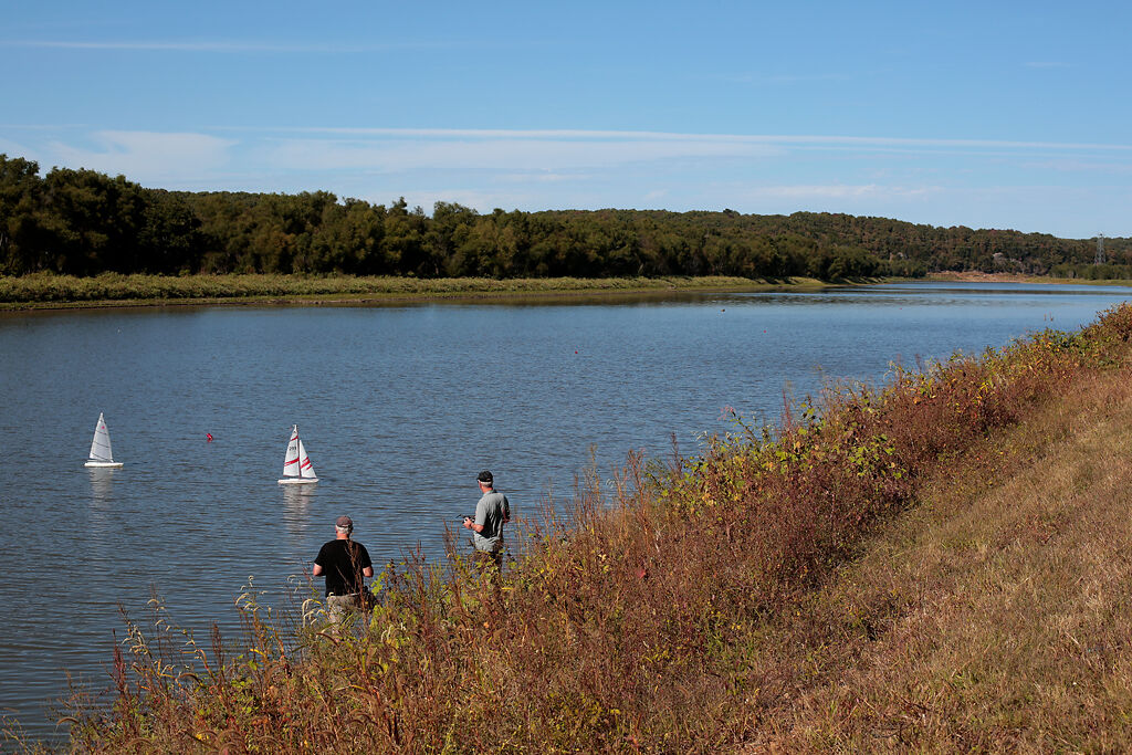 Rick Wangering and Bill McGregor pilot remote control sailboats on the Osceola Lake on Friday, Oct. 2, in Osceola, Mo.